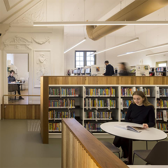 Woman reading a book at Haberfield Library